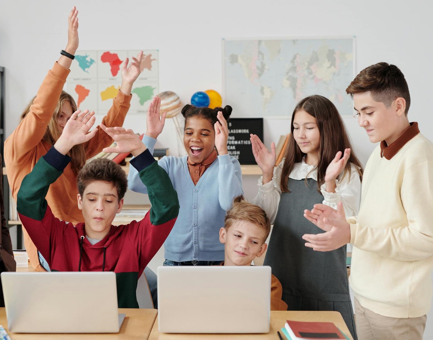 Students waving